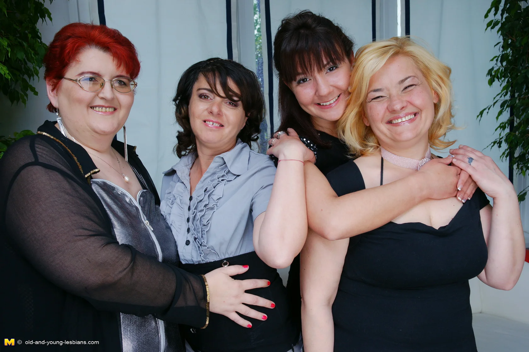 Four old and young lesbians having a party