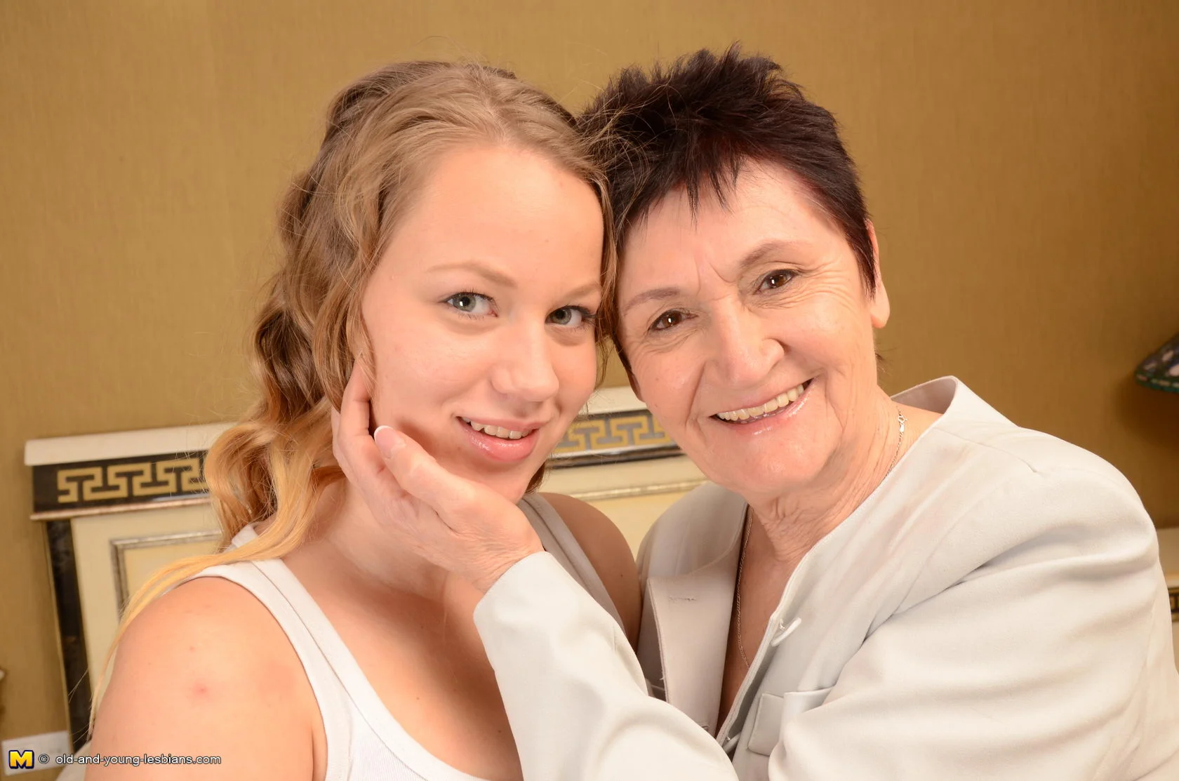 Old and young lesbian couple getting wet