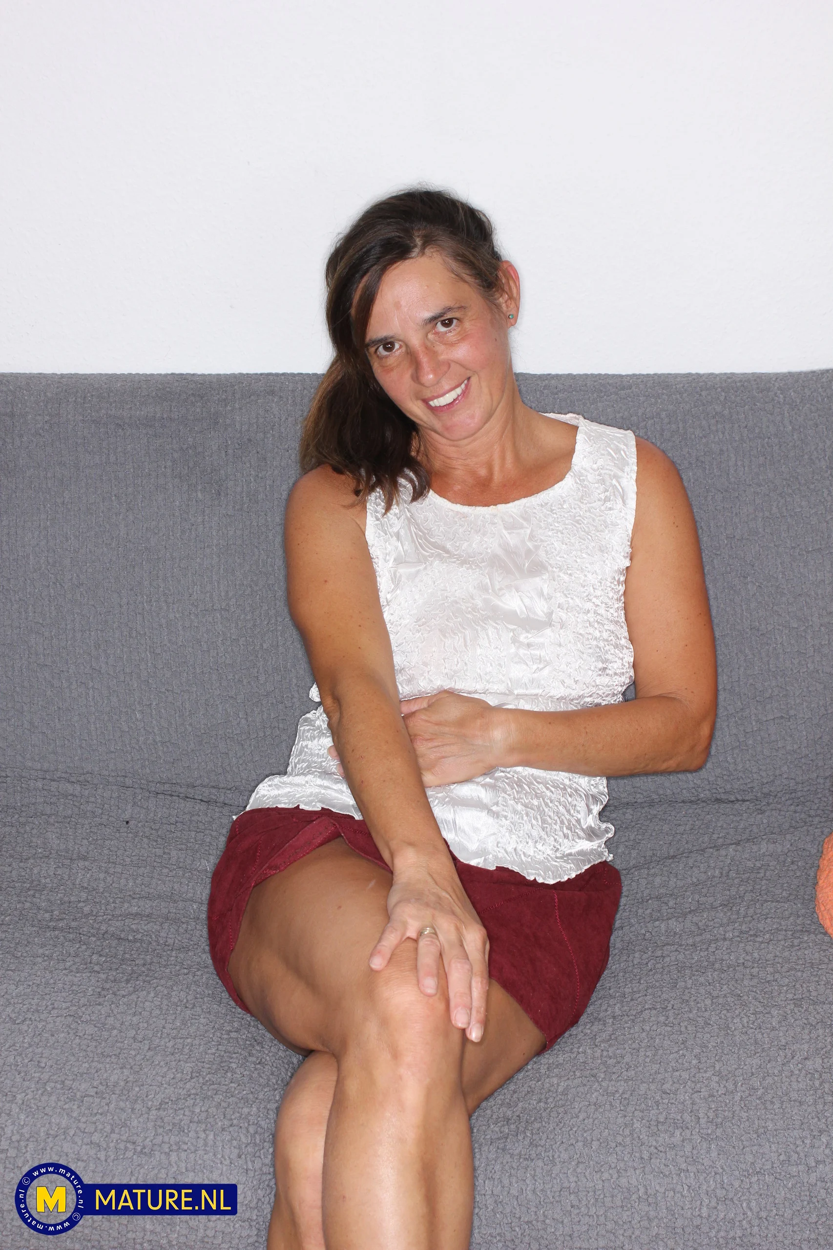 Emi is a 54 year old MILF who loves to get fisted and fucked by her neighbor