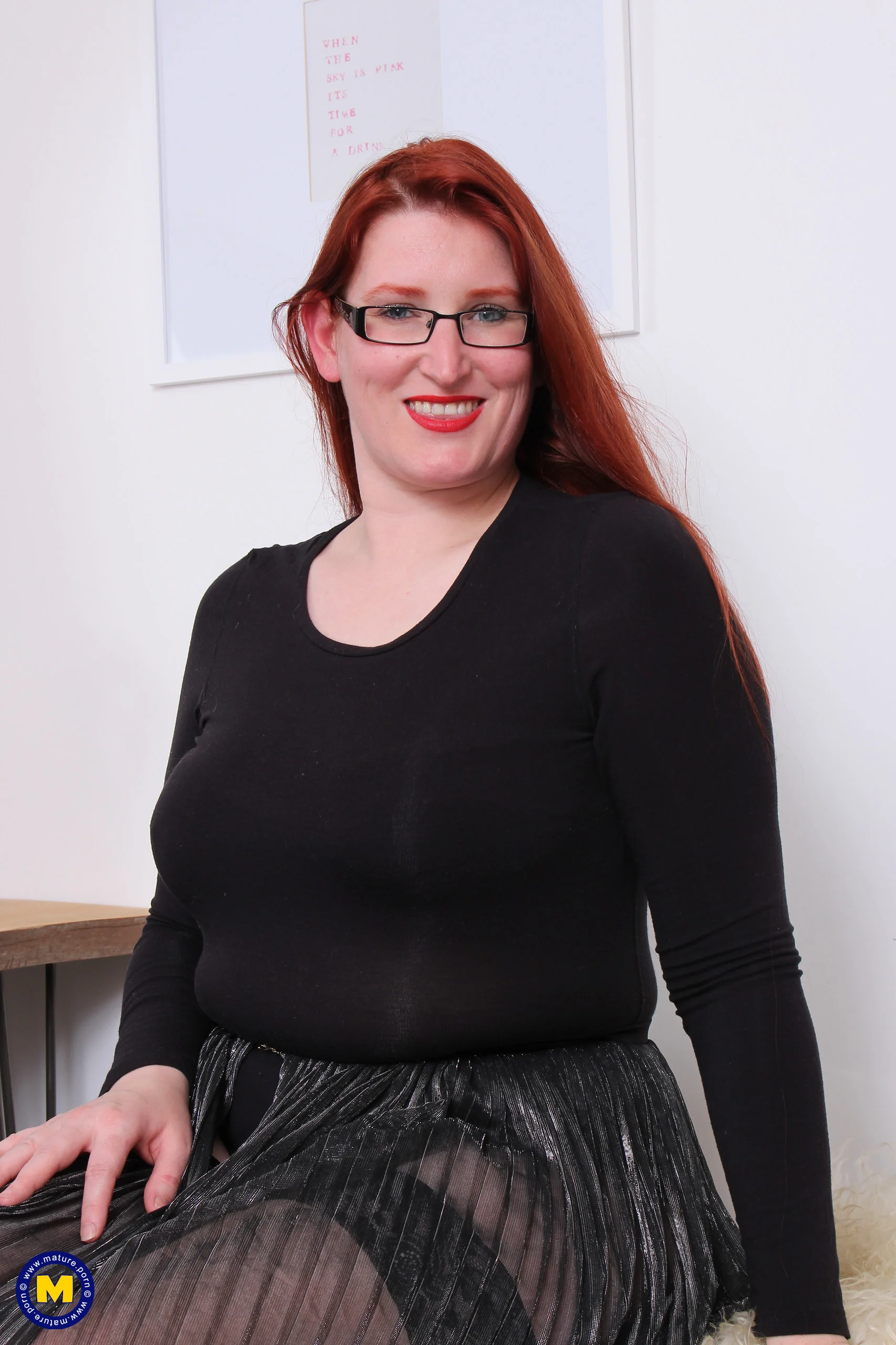 Curvy mature redhead playing with her hairy pussy